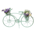 Countrybike-Modell mit Blumenkorb auf dem Boden